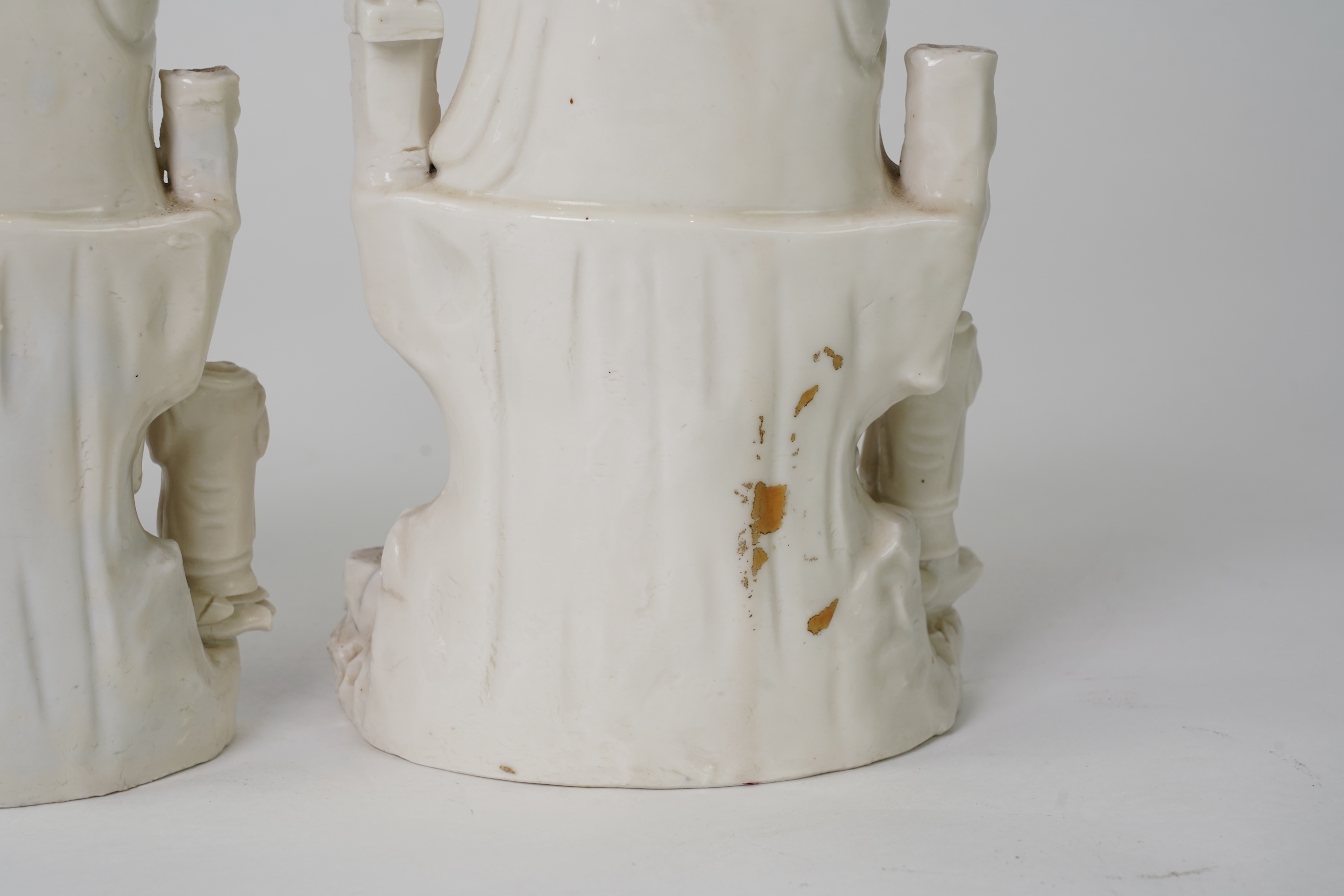 A pair of Chinese blanc de chine groups of Guanyin and children, 18th century
